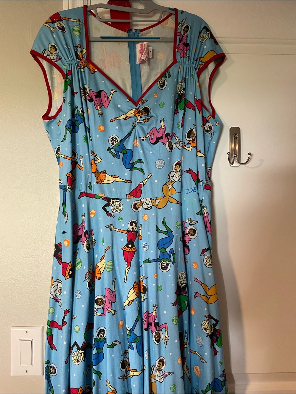 Pinup Couture Light Blue Retro Space Superhero Print Dress with Red Trim